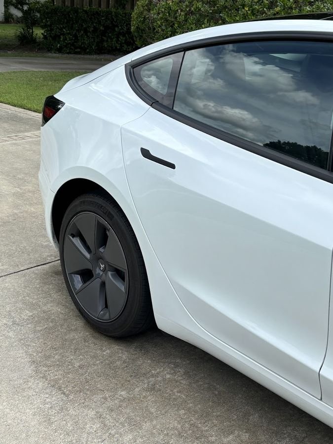 White Tesla Model 3 after a full detail